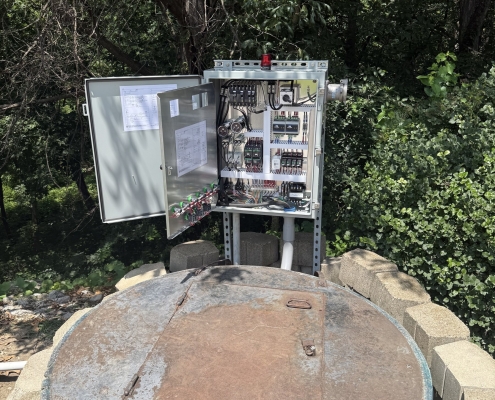 Open electrical control panel at a lift station